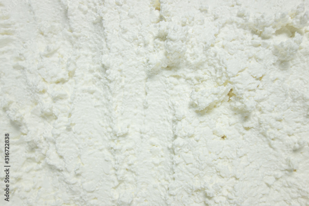 Textured white substance background. Foam consistence backdrop closeup view of ice cream, cotton cheese or snow like. Mock-up or template for design banner and poster Textured white substance background. Foam consistence backdrop closeup view of ice cream, cotton cheese or snow like. Mock-up or template for design banner and poster