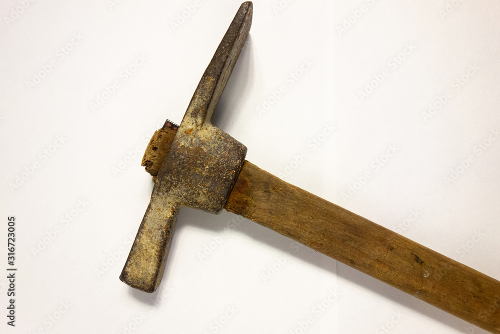 Miner hammer like pickaxe or mattock on white isolated background with  shadow. Closeup view of rustic