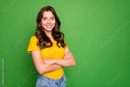 Portrait of her she nice-looking attractive lovely winsome cheerful cheery content wavy-haired girl folded arms isolated over bright vivid shine vibrant green color background photo