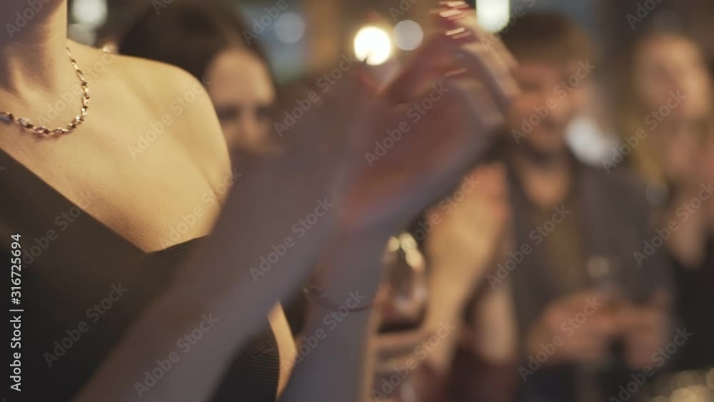 Close up of business people hands clapping at corporate conference