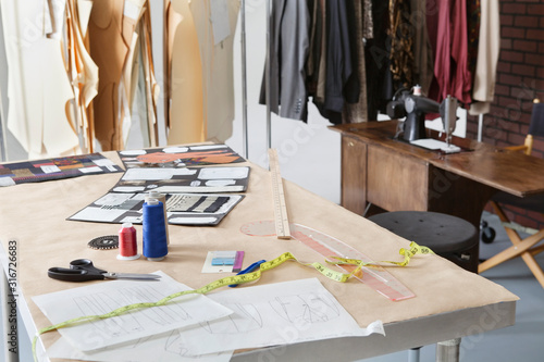 Fashion designing materials on table in design studio