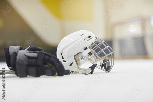 Photography Background image of hockey equipment lying on ice in outdoor skating arena, copy