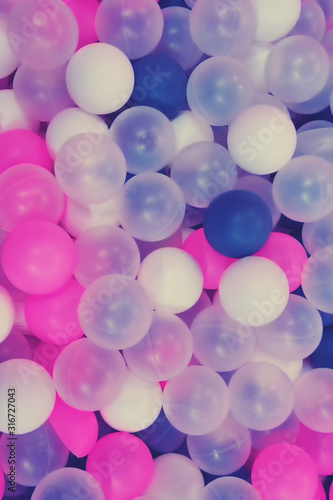Background of colored balls of the same size, texture muted soft tones