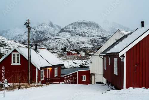 Fotografie Traditional red houses of northern Norway in winter