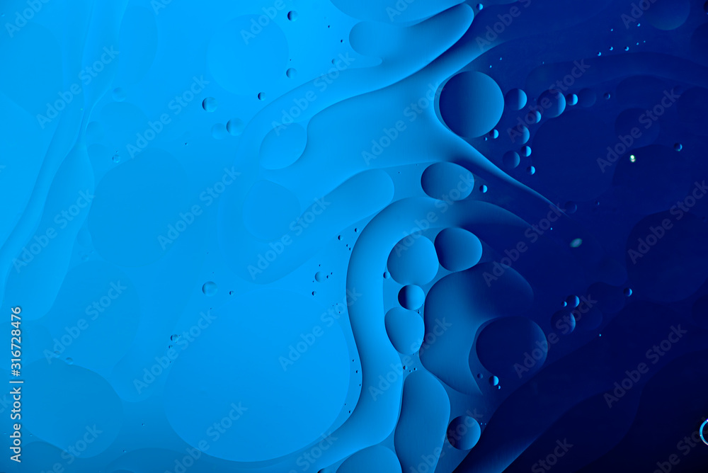 Fototapeta oil drops on water surface in color of year-classic blue, abstract background, texture