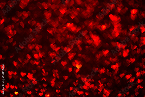 Abstract light, red bokeh pattern in heart shape. St Valentines Day or Holiday concept, background image.