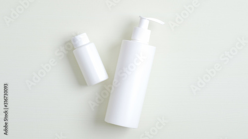 White plastic bottle with pump and essential oil for hair container branding mockup. Cosmetics SPA, shampoo and lotion packaging