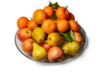 Apples, pears and tangerines in a plate isolated on a white background.