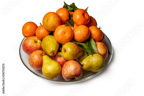 Apples  pears and tangerines in a plate isolated on a white background.