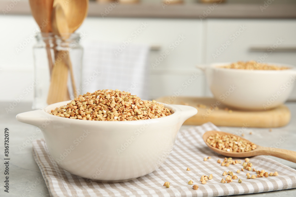Organic green buckwheat on marble table. Healthy food Organic green buckwheat on marble table. Healthy food