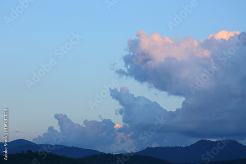 landscape image, large cloud on sky above mountain hill