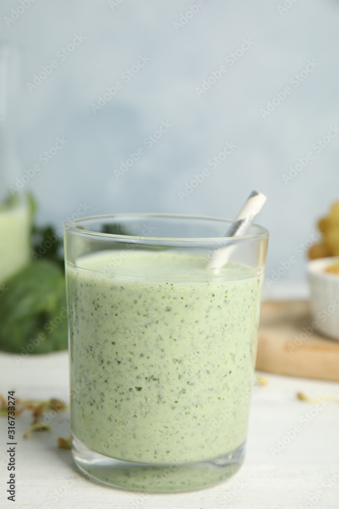 Green buckwheat smoothie on white wooden table Green buckwheat smoothie on white wooden table