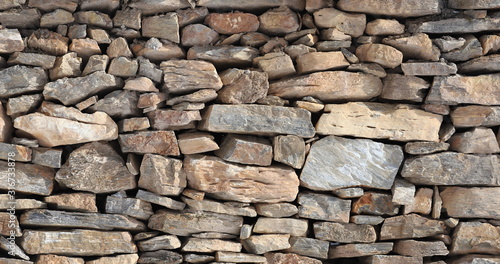 pattern gray color uneven cracked real stone wall surface texture