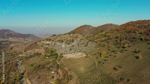 Aerial drone zoom in shot of Noyemberyan cemetry in Armenia. Old ancient cemetry in suburban of Noyemberyan, Armenia in summer time at daylight