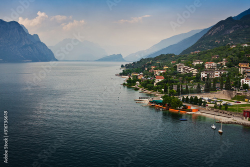 Panorama of one of the most beautiful cities on lake Garda in the province of Veneto in Northern Italy - Malcesine  view of the promenade  Scaliger castle and the Lago di Garda
