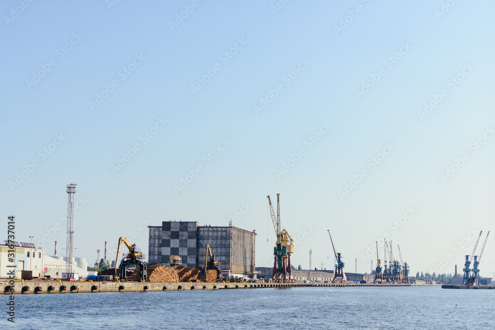 Fototapeta premium Port of Szczecin. Harbor buildings in northern Poland. Season of the spring. Odra river.