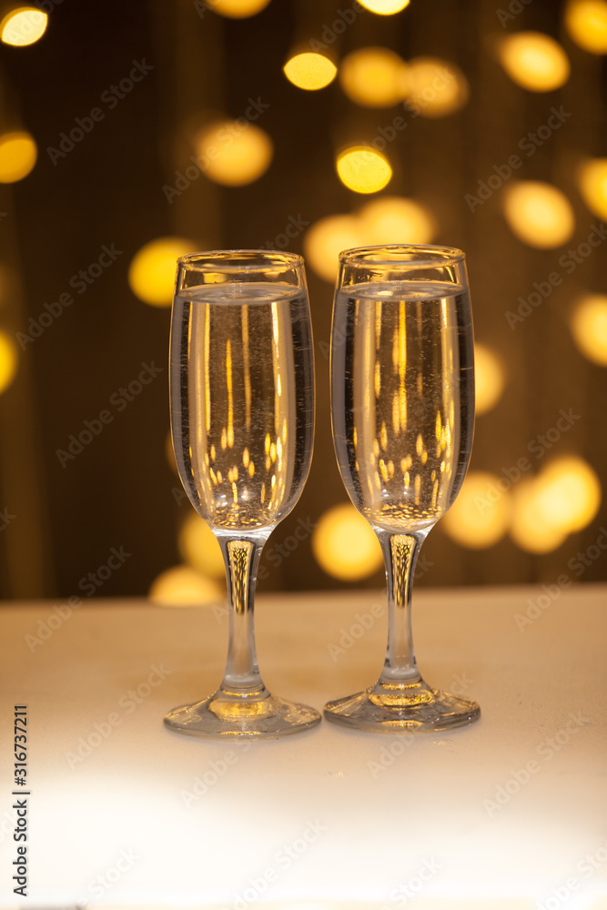 Two glasses of pink champagne for the couple. Two glasses of pink champagne for the couple.