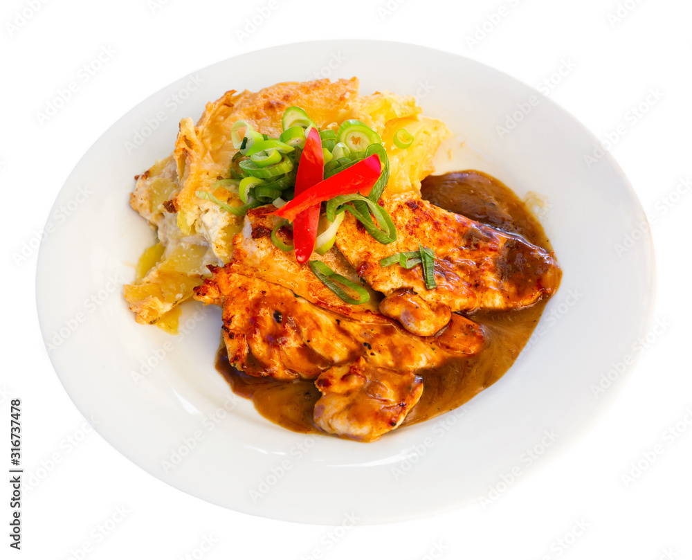 Sliced chicken with baked potatoes. Czech cuisine