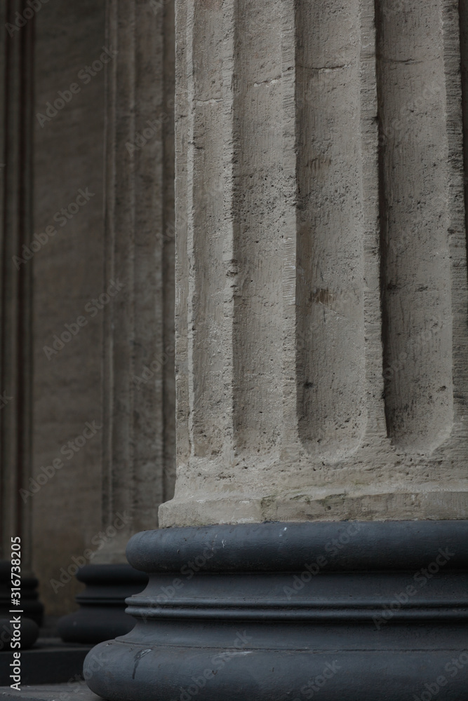 ancient Corinthian column on round base close up