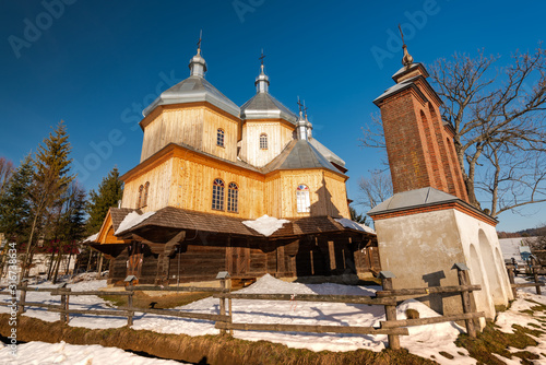 Fototapeta Naklejka Na Ścianę i Meble -  Exterior of Bystre Wooden Orthodox Church.  Bieszczady Architecture in Winter. Carpathia Region in Poland