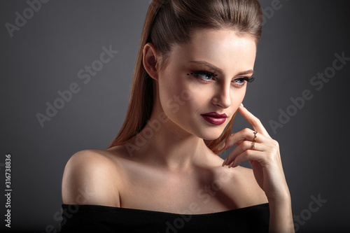 beauty portrait of young woman with fashion makeup and fantasy eyelashes