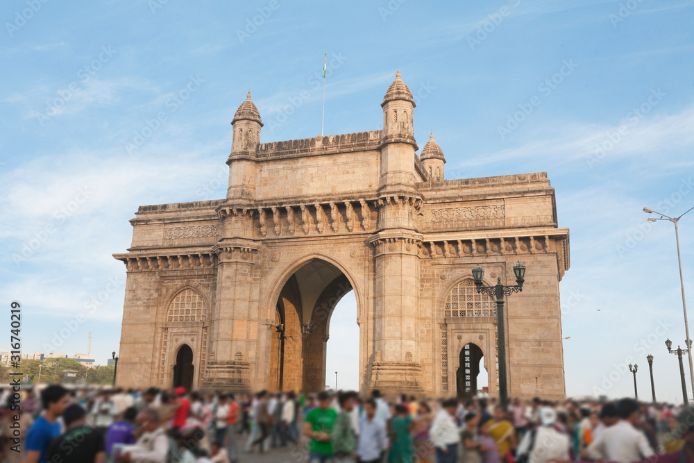 People at Gateway of India, Mumbai's tourist district and most famous landmark