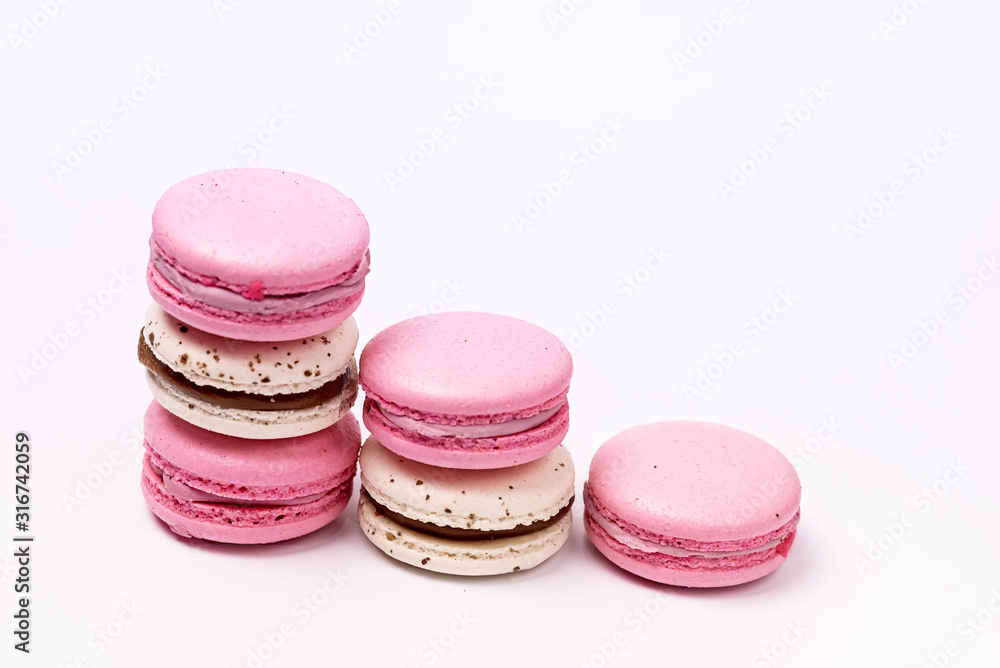 Stack of Pink and White Macarons on White Background French Dessert Caramel and Strawberry Macarons Horizontal Stack of Pink and White Macarons on White Background French Dessert Caramel and Strawberry Macarons Horizontal