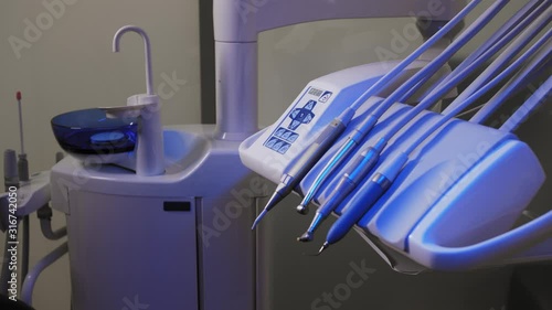 The workplace of the dentist with the dental unit and chair, close-up