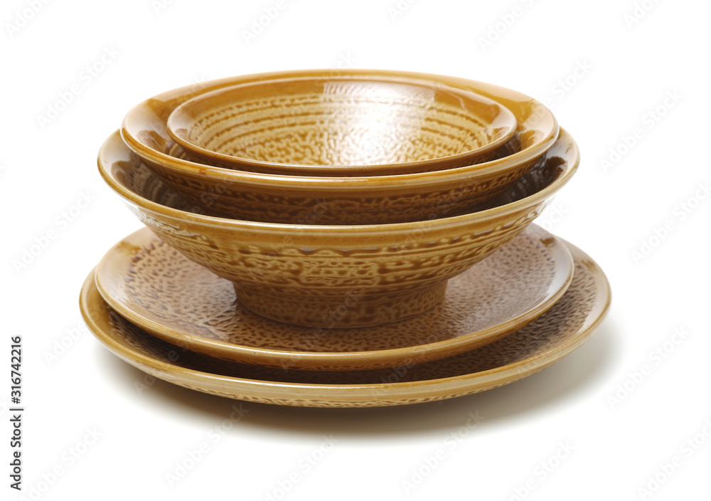 Empty earthenware plate and bowl on white background Empty earthenware plate and bowl on white background