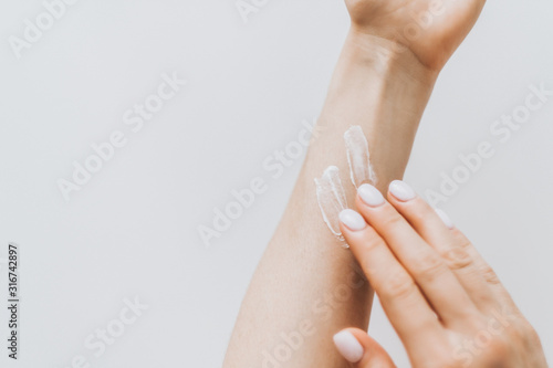 Hand Skin Care. Close Up Of Female Hands Applying Cream, Lotion.