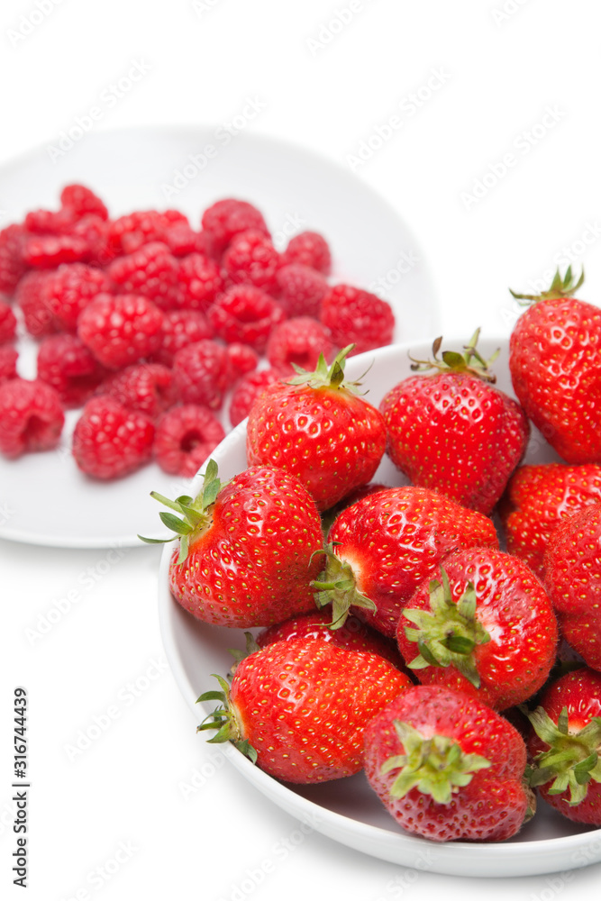 Strawberries and raspberries over white background Strawberries and raspberries over white background