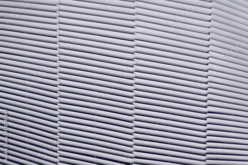 Texture of simple slanted lines. Background metal bars of the inclined strips of ventilation, texture