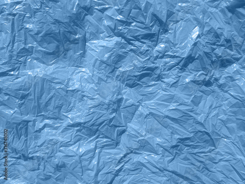 Blue creased plastic bag or paper background 