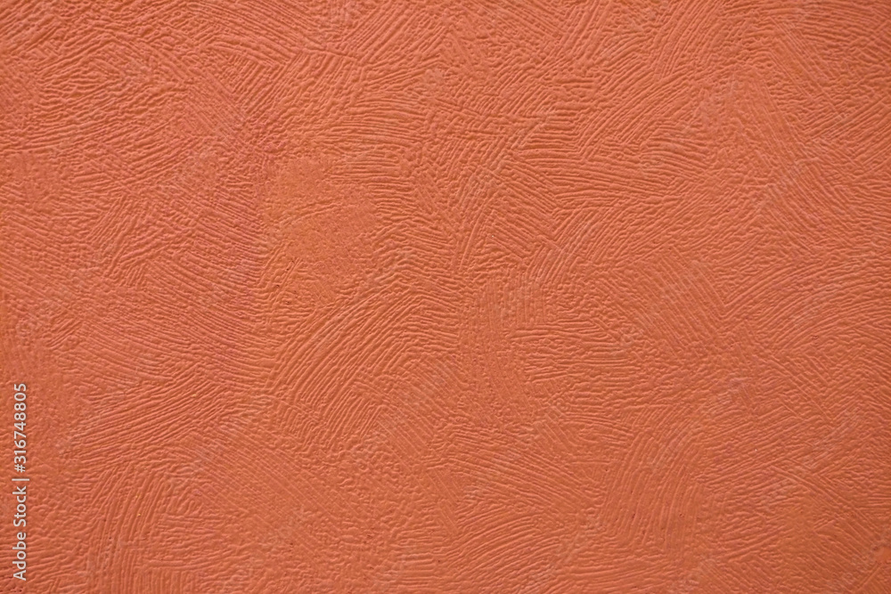 Surface background with smears of dark orange paint, close-up texture Surface background with smears of dark orange paint, close-up texture