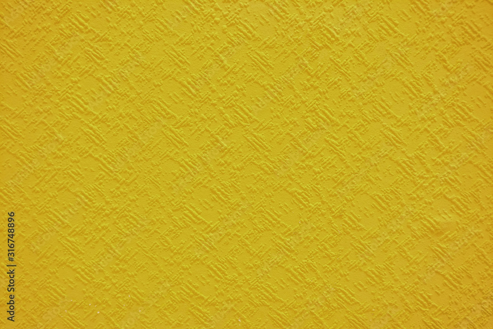 Surface background with strokes of yellow paint, close-up texture Surface background with strokes of yellow paint, close-up texture