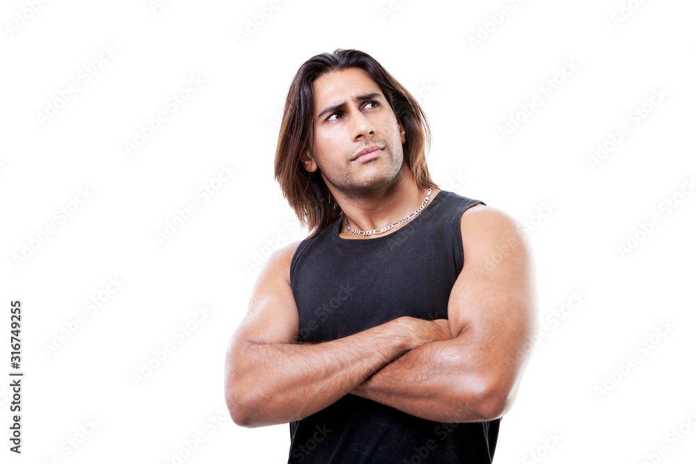 Portrait of thoughtful young man standing with arms crossed Portrait of thoughtful young man standing with arms crossed
