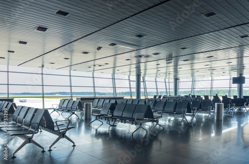 Waiting hall in the airport with empty arm-chairs.