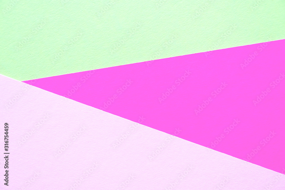 Lilac, soft pastel green and light pink colored textured paper for the background. Geometric empty paper background of three tones for copy space. Lilac, soft pastel green and light pink colored textured paper for the background. Geometric empty paper background of three tones for copy space.