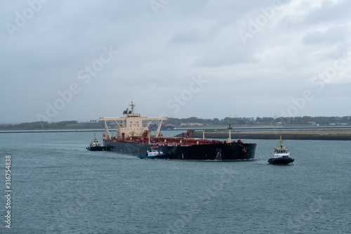 Oil tanker maneuvers in Port of Rotterdam