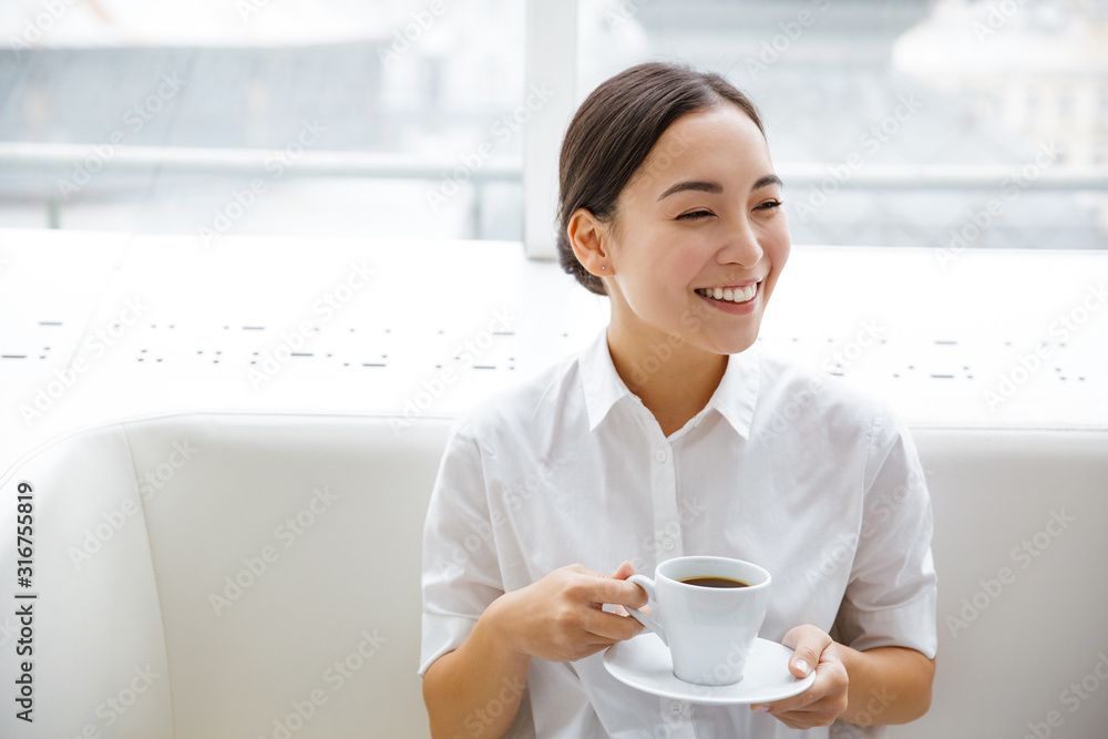Smiling attractive young asian businesswoman Smiling attractive young asian businesswoman
