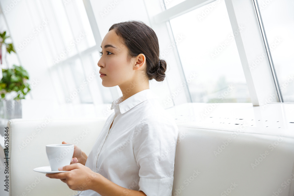 Smiling attractive young asian businesswoman Smiling attractive young asian businesswoman
