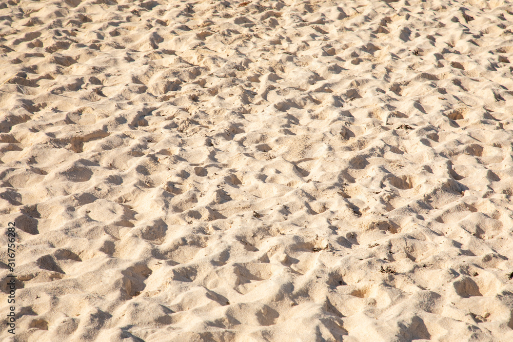 Fine sand texture - Sandy sunny beach for background - Top view - Full frame shot - Close-up sun sand texture on beach in summer – travel holiday vacation Close up Fine sand texture - Sandy sunny beach for background - Top view - Full frame shot - Close-up sun sand texture on beach in summer – travel holiday vacation Close up