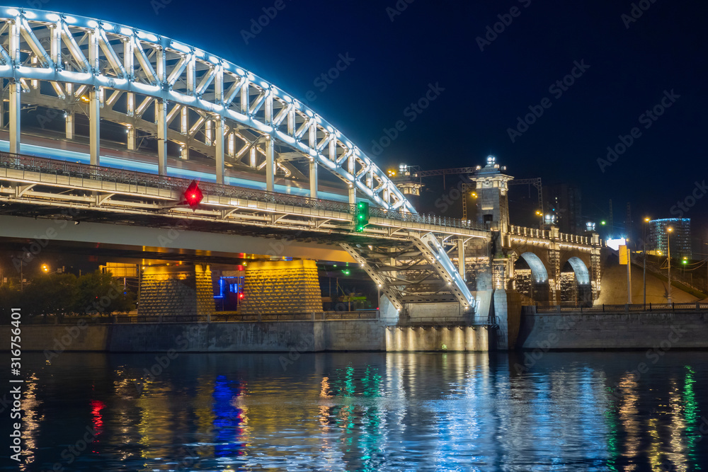 Russia.Saint Petersburg.Peter the Great Bridge at night. Bolsheokhtinsky bridge in the night lights. Drawbridges of St. Petersburg.Canals of Saint Petersburg. Cities of Russia. Traveling in Russia Russia.Saint Petersburg.Peter the Great Bridge at night. Bolsheokhtinsky bridge in the night lights. Drawbridges of St. Petersburg.Canals of Saint Petersburg. Cities of Russia. Traveling in Russia