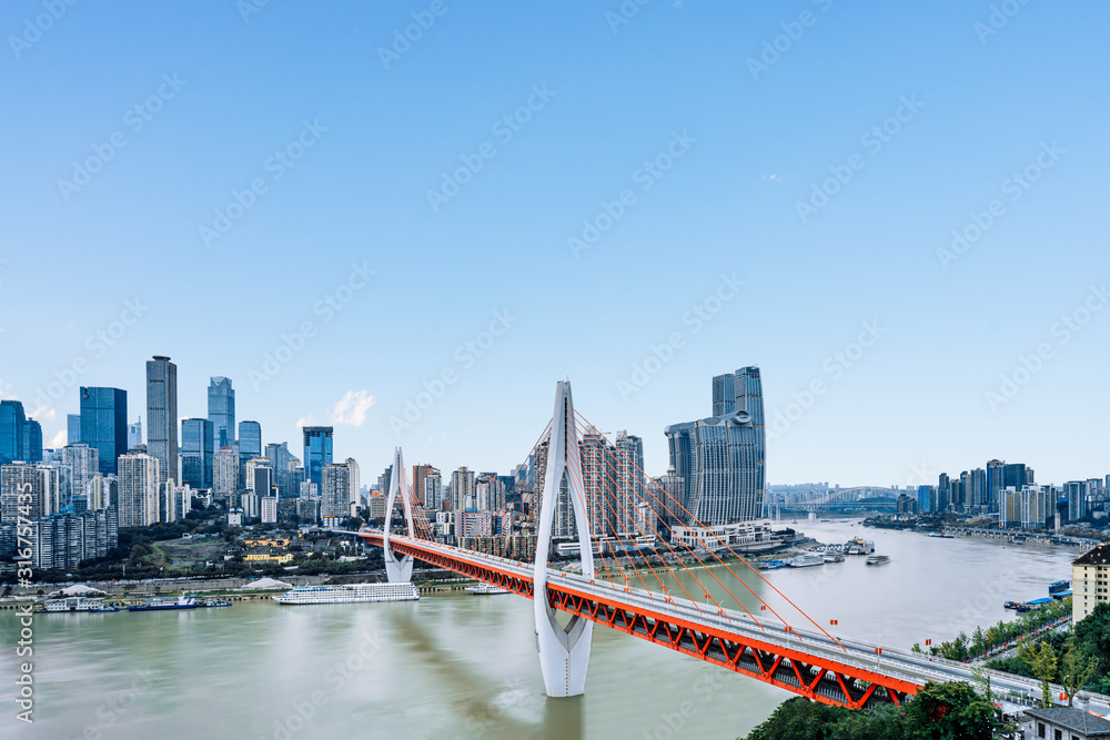 Fototapeta premium High rise buildings and dongshuimen bridge in Chongqing, China