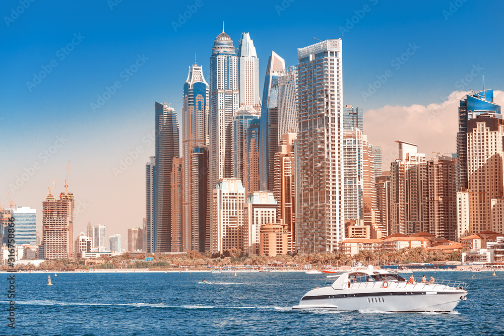 Obraz premium Cityscape view of Dubai skyscrapers - hotels and apartment buildings. Real estate in Persian Gulf concept. Elite resort in United Arab Emirates