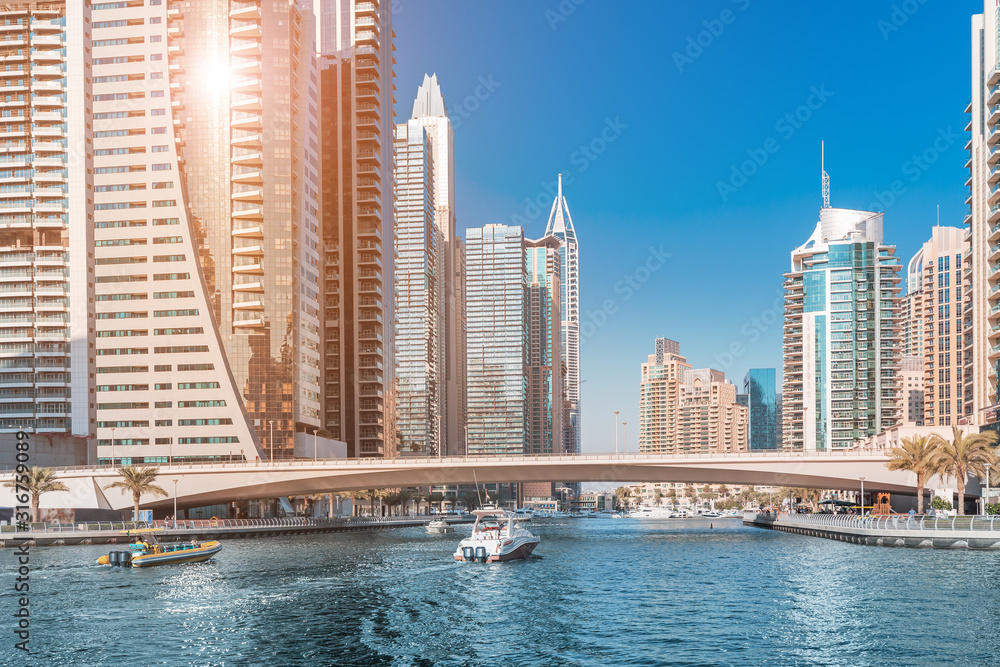 Fototapeta premium Panoramic view of dubai marina port and tall skyscrapers. Tourist destinations and real estate concept