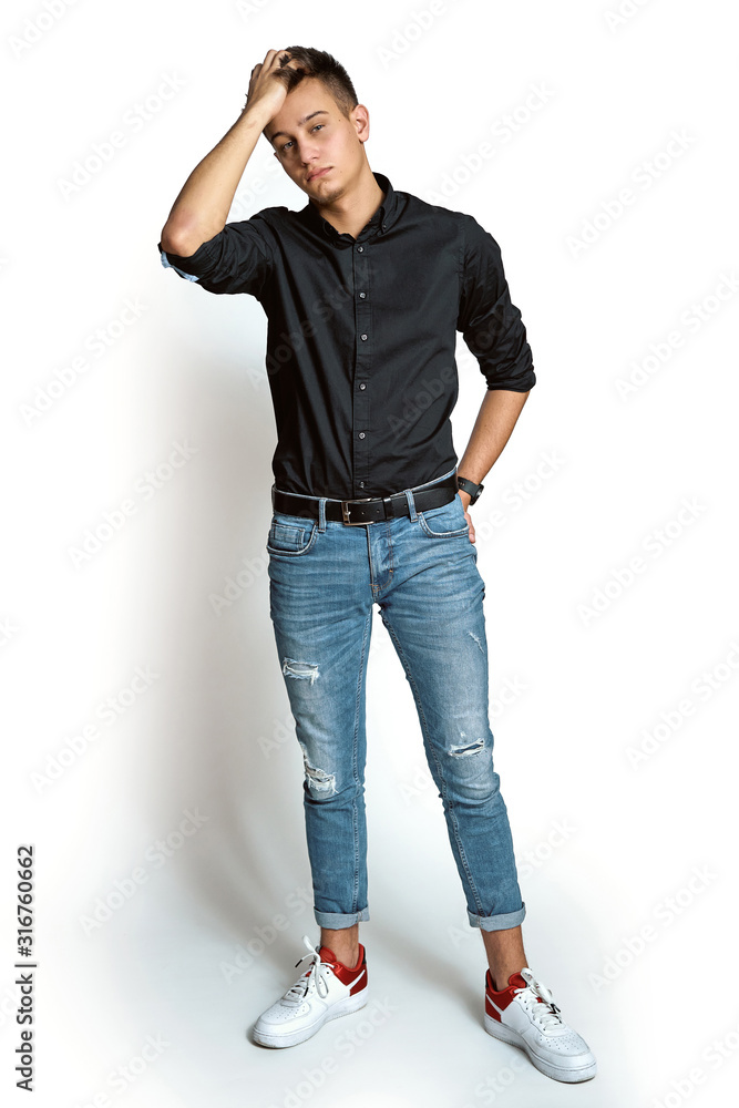 Fashion portrait of young man in shirt on white background Fashion portrait of young man in shirt on white background
