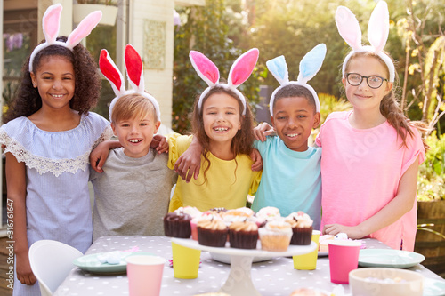 Photography Portrait Of Children Wearing Bunny Ears Enjoying Outdoor Easter Party In Garden
