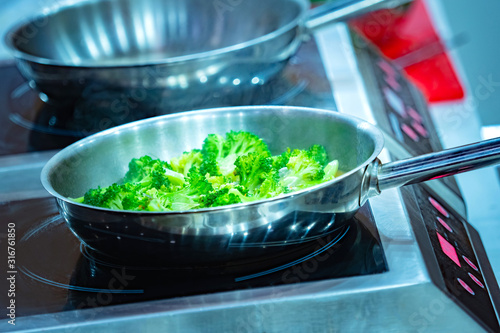 Broccoli in a pan. Cooking ...