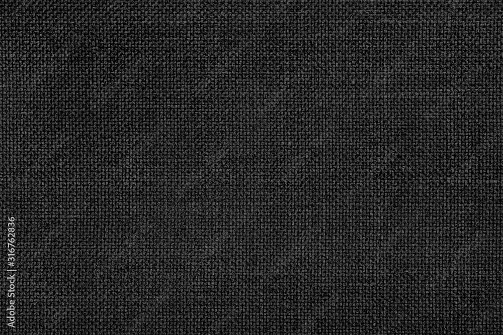 Close-up texture of natural weave cloth in dark and black color. Fabric